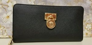 A beautiful black/gold MK wallet